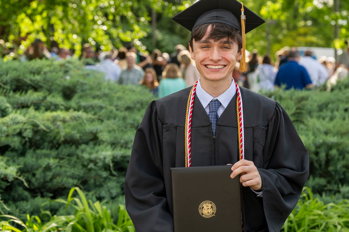 Student outside at graduation
